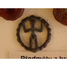 Figure of a man inside a circle that resembles the sun